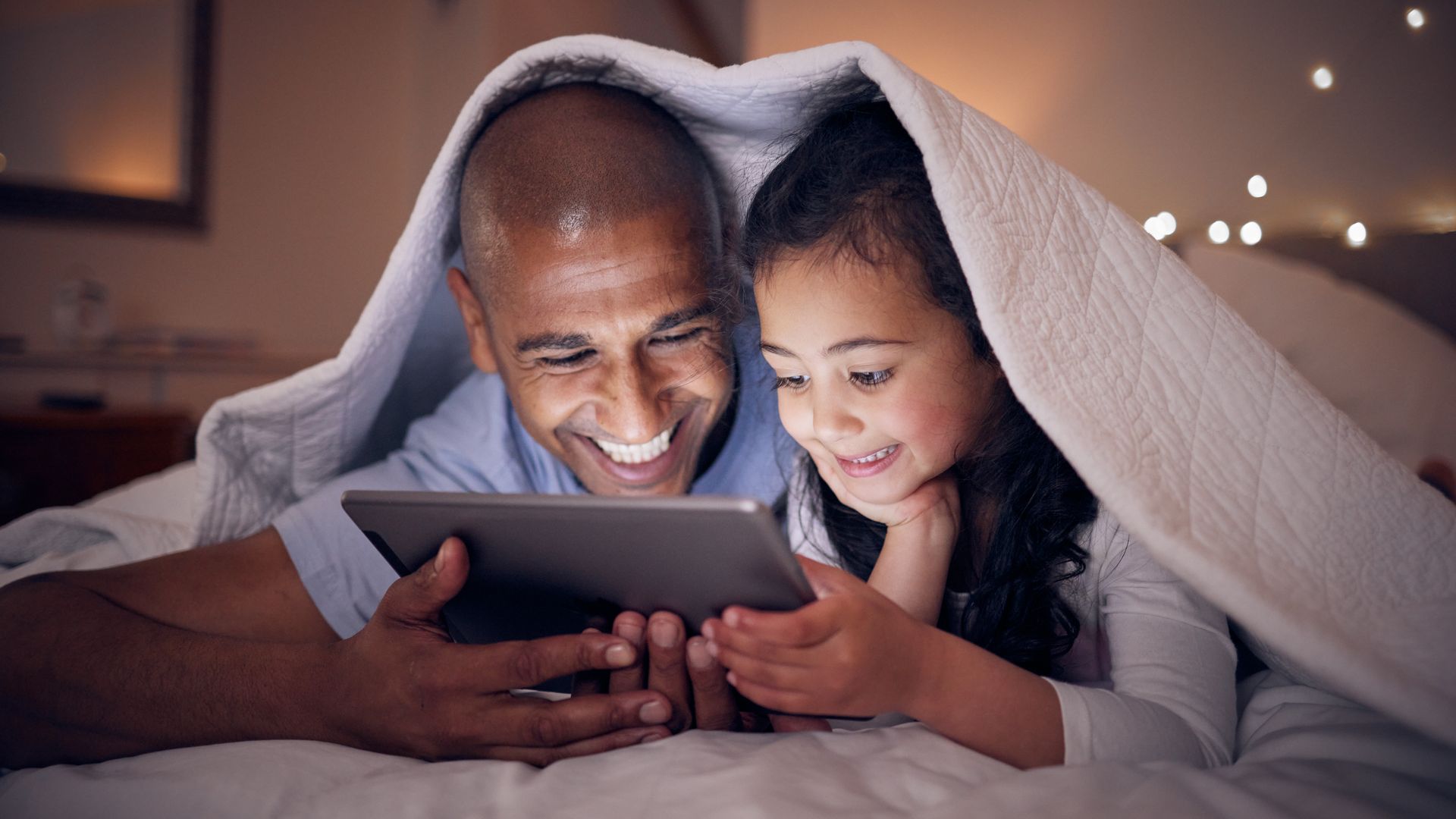 Father and daughter reading together